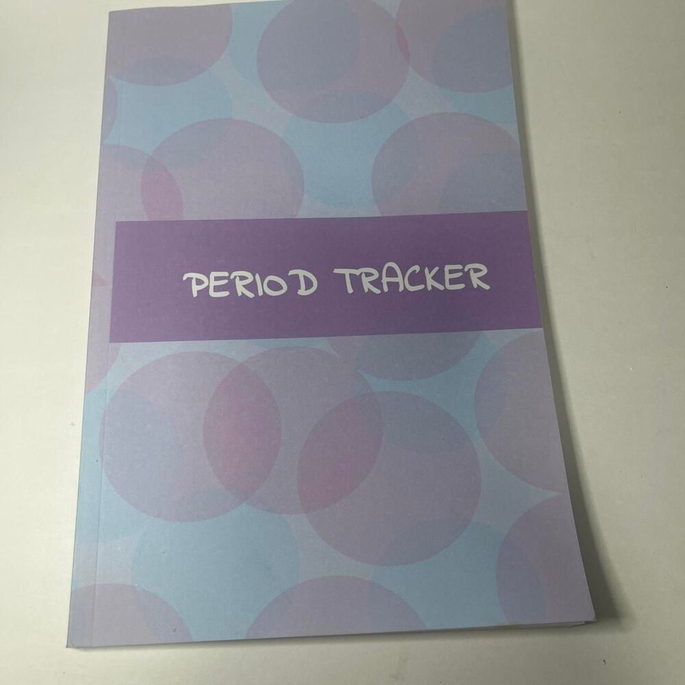 Period Tracker with purple polka dots on light blue background